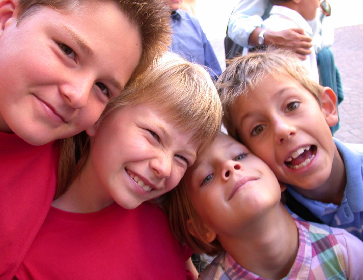 Children laughing happily into the camera