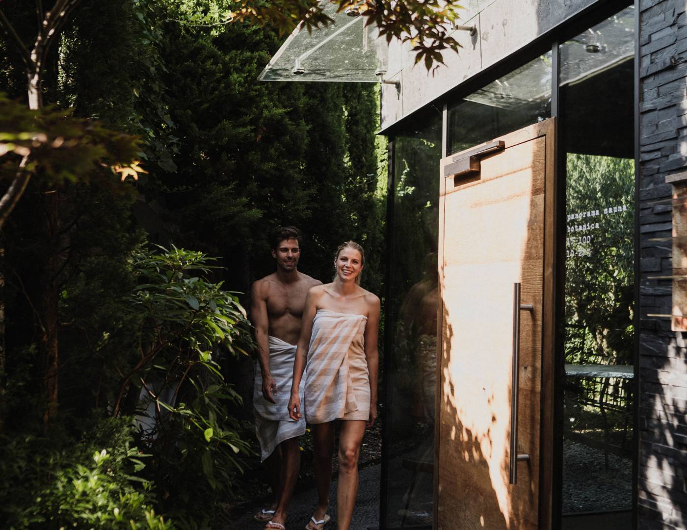 Couple walking to the panoramic sauna in the 5-star wellness hotel in Merano, South Tyrol