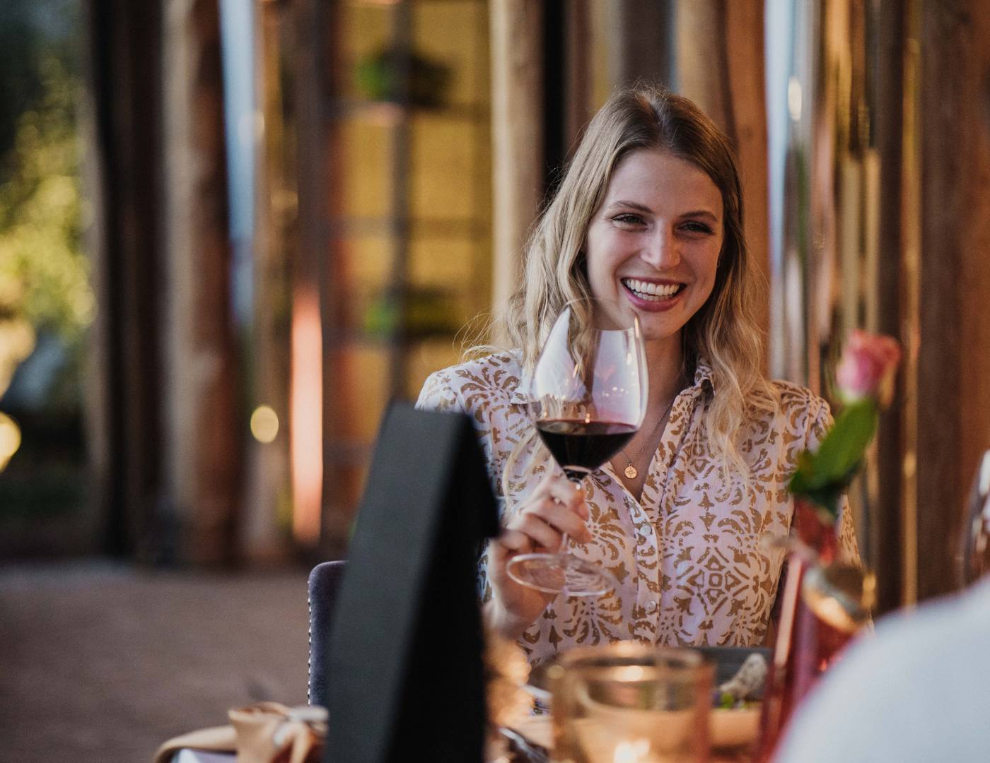 Woman with wine at dinner